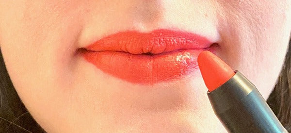 Lips with coral lip pencil color